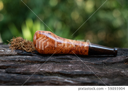 This Tobacco pipe is made from burl wood at white background This Tobacco pipe is made from burl wood at white background 59893904