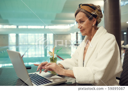 Senior Woman Using Laptop in SPA Resort 59895087