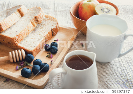 Breakfast Nature Vegan Vegetarian Food With Milk, Honey, Bread and Natural Fresh Fruit on a Table 59897377