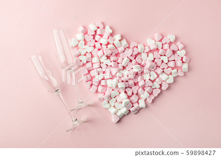Champagne glasses and heart shaped sweets holiday Champagne glasses and heart shaped sweets holiday 59898427