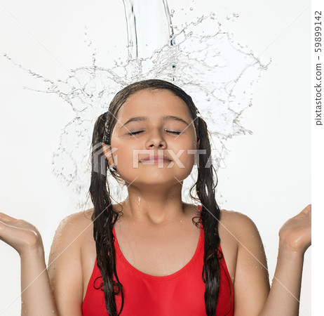 Teenage pretty girl catching water stream from top Teenage pretty girl catching water stream from top 59899142