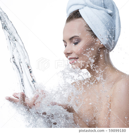 Happy girl and water stream falling to her hands 59899180
