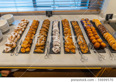 Assortment of delicious pastry beautifully arranged at buffet restaurant Assortment of delicious pastry beautifully arranged at buffet restaurant 59899570
