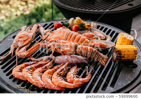 Lobster and mix seafood barbecue cooking on griller Lobster and mix seafood barbecue cooking on griller 59899600