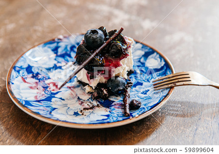 Blueberry Cheese pie already eaten on oriental style beautiful dish 59899604