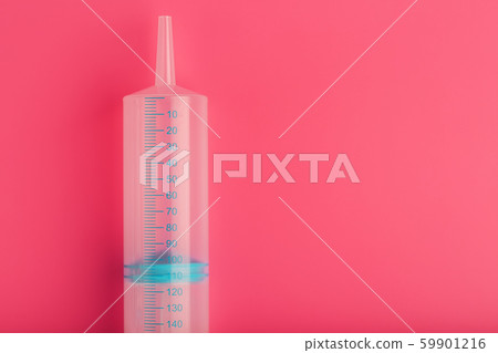 Medical syringe on cyanide, pink background Medical syringe on cyanide, pink background 59901216