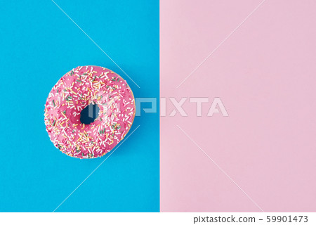 donut on a pastel pink and blue background. donut on a pastel pink and blue background. 59901473
