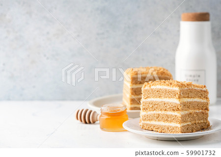 Medovik honey layer cake on white plate 59901732