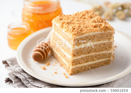 Slice of honey cake. Layered gingerbread honey cake 59901859