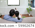 Back view of young family, man and woman watching 59902674