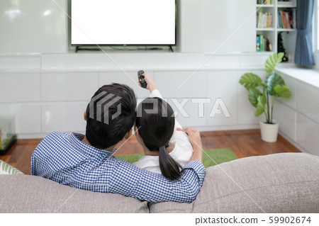 Back view of young family, man and woman watching 59902674