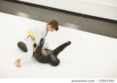 Little boy training in gym 59903440