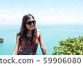 Young, beautiful woman at the sea 59906080
