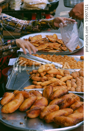 tray crispy snacks cake from powder deep fried at Ho Chi Minh city outdoor food street  59907321