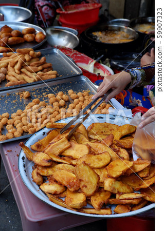 tray crispy snacks cake from powder deep fried at Ho Chi Minh city outdoor food street tray crispy snacks cake from powder deep fried at Ho Chi Minh city outdoor food street 59907323
