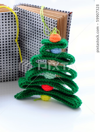 Christmas ribbon tree and colorful baubles with paper notebook on white background 59907328