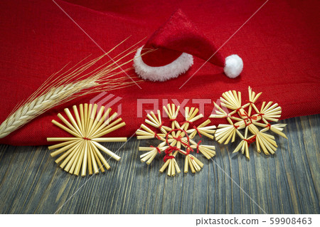 Rustic Christmas still life with straw ornaments Rustic Christmas still life with straw ornaments 59908463