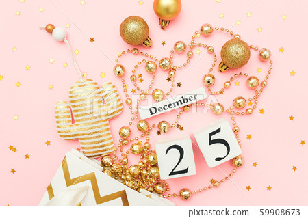 Wooden calendar December 25, textile christmas cactus, golden baubles, stars confetti on pink Wooden calendar December 25, textile christmas cactus, golden baubles, stars confetti on pink 59908673