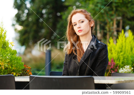Woman waiting in outdoor restaurant cafe. Woman waiting in outdoor restaurant cafe. 59909561