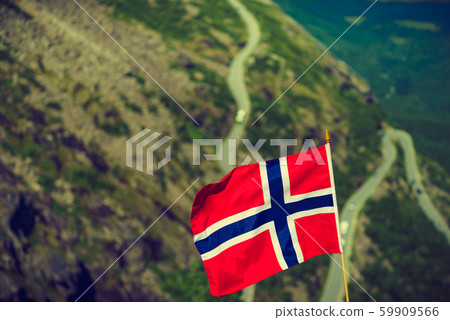 Norwegian flag and Trollstigen mountain road Norwegian flag and Trollstigen mountain road 59909566