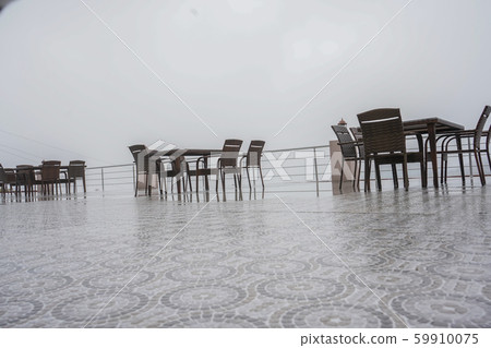 Empty Local Coffee Shop or outdoor restaurant on the mountain with foggy weather. Empty Local Coffee Shop or outdoor restaurant on the mountain with foggy weather. 59910075