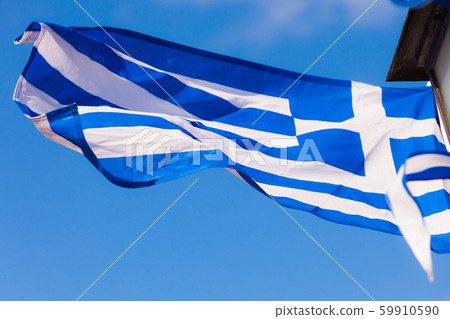 Greek flag waving against blue sky Greek flag waving against blue sky 59910590