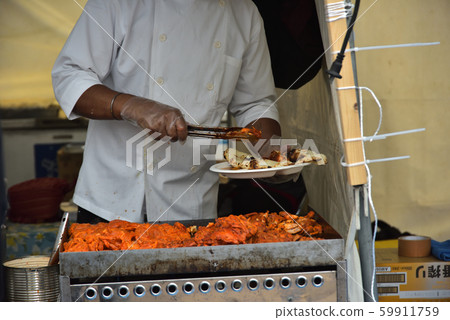 Indian restaurant stall, assorted Nan and tandoori chicken 59911759