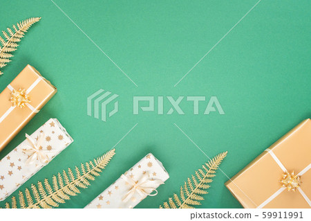 Green christmas background with gift boxes 59911991