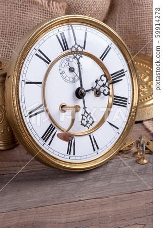 Broken antique wall clock, concept of memory and past 59914278