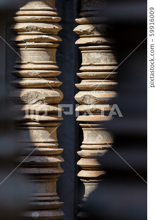 Stone pillar window decor in Banteay Samre temple in Cambodia Stone pillar window decor in Banteay Samre temple in Cambodia 59916009