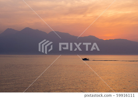Beppu Bay sunset and fishing boat 59916111