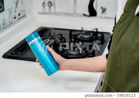Woman with a water bottle 59916113