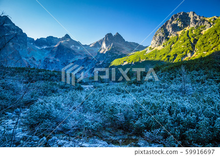 Frozen mountain valley at late autumn period. Frozen mountain valley at late autumn period. 59916697