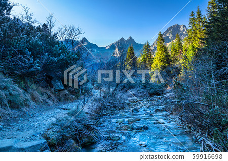 Frozen mountain valley at late autumn period. Frozen mountain valley at late autumn period. 59916698