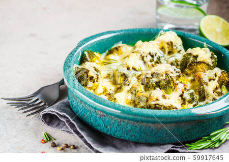 Baked broccoli casserole with cheese in blue dish Baked broccoli casserole with cheese in blue dish 59917645