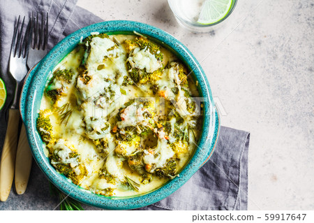 Broccoli casserole with cheese in blue dish Broccoli casserole with cheese in blue dish 59917647