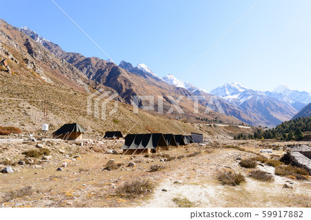 Camping area lightweight backpacking expedition canvas tents installed near himalayas mountain  59917882