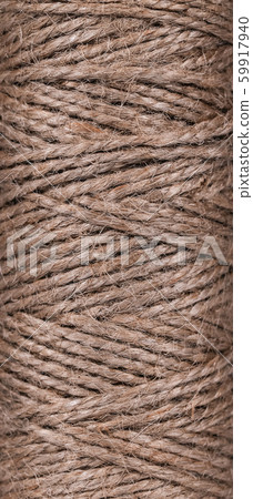 Top view of natural jute twine skein texture. Top view of natural jute twine skein texture. 59917940