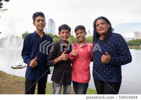 Portrait of Indian family relaxing together at the park 59918804
