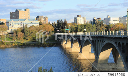 Scene of Saskatoon, Canada downtown by river 59918968