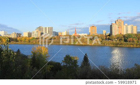 Scene of Saskatoon, Canada skyline over river 59918971