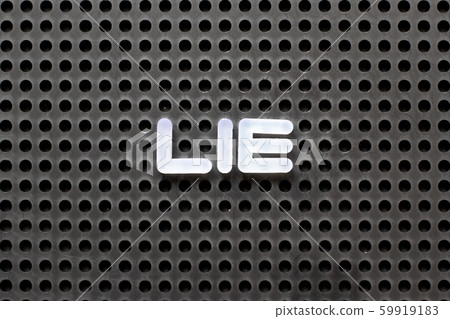 Black color pegboard with white letter in word lie Black color pegboard with white letter in word lie 59919183