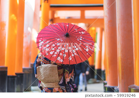 Geishas girl wearing Japanese kimono among red 59919246