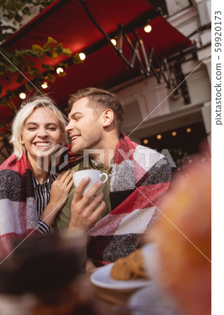 Cheerful couple enjoying their date drinking coffee Cheerful couple enjoying their date drinking coffee 59920173