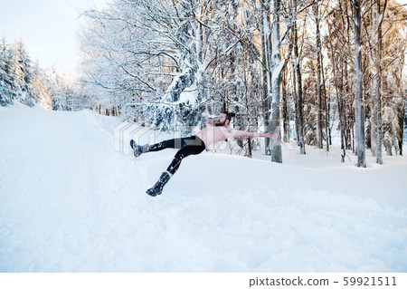 Topless young man outdoors in snow in winter forest, having fun. Topless young man outdoors in snow in winter forest, having fun. 59921511