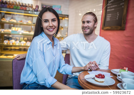 Couple enjoying their weekend morning in cafeteria 59923672