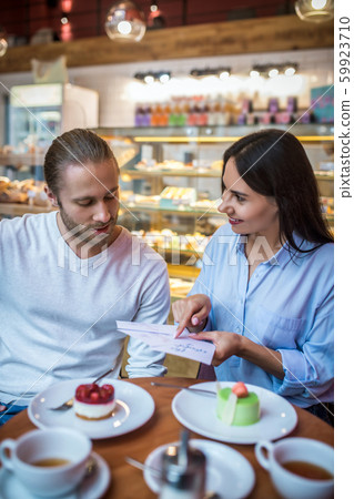 Man and woman discussing wedding invitations together 59923710