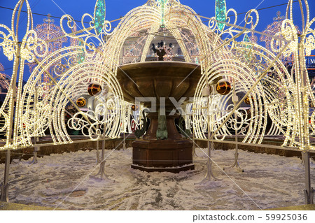 Electric fountain at night, lighted during christmas near the Bolshoi Theatre (Large, Great or Grand Theatre, also spelled Bolshoy), Moscow, Russia Electric fountain at night, lighted during christmas near the Bolshoi Theatre (Large, Great or Grand Theatre, also spelled Bolshoy), Moscow, Russia 59925036