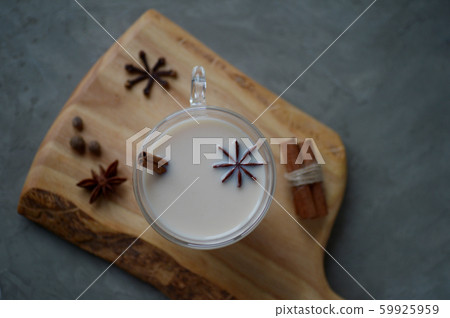 Indian masala chai tea, spiced tea with milk on 59925959