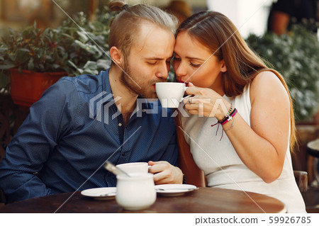 Beautiful couple spend time in a summer city Beautiful couple spend time in a summer city 59926785